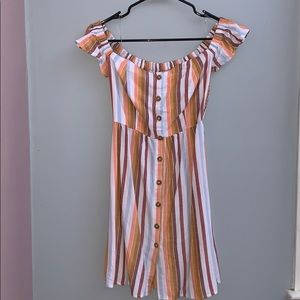 A strapless dresse orange, brown, white, and, blue